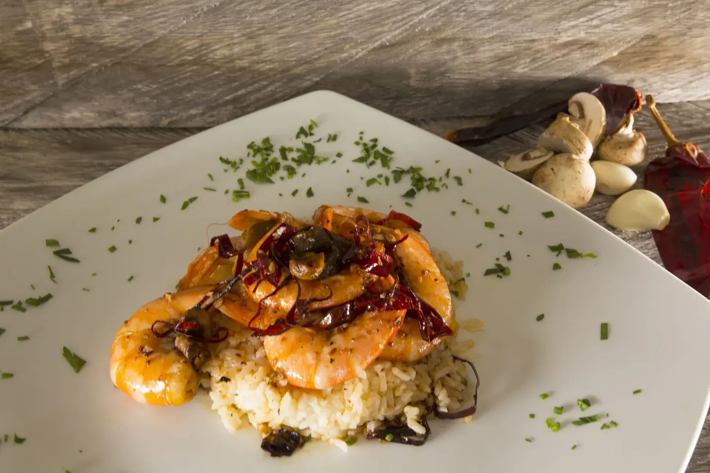 Shrimp and rice dish on a square plate at Vamar Vallarta Marina and Beach Resort.