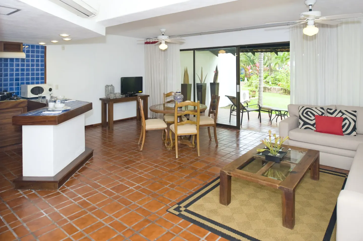 One Bedroom Villa living room with kitchenette at Vamar Vallarta Marina and Beach Resort.