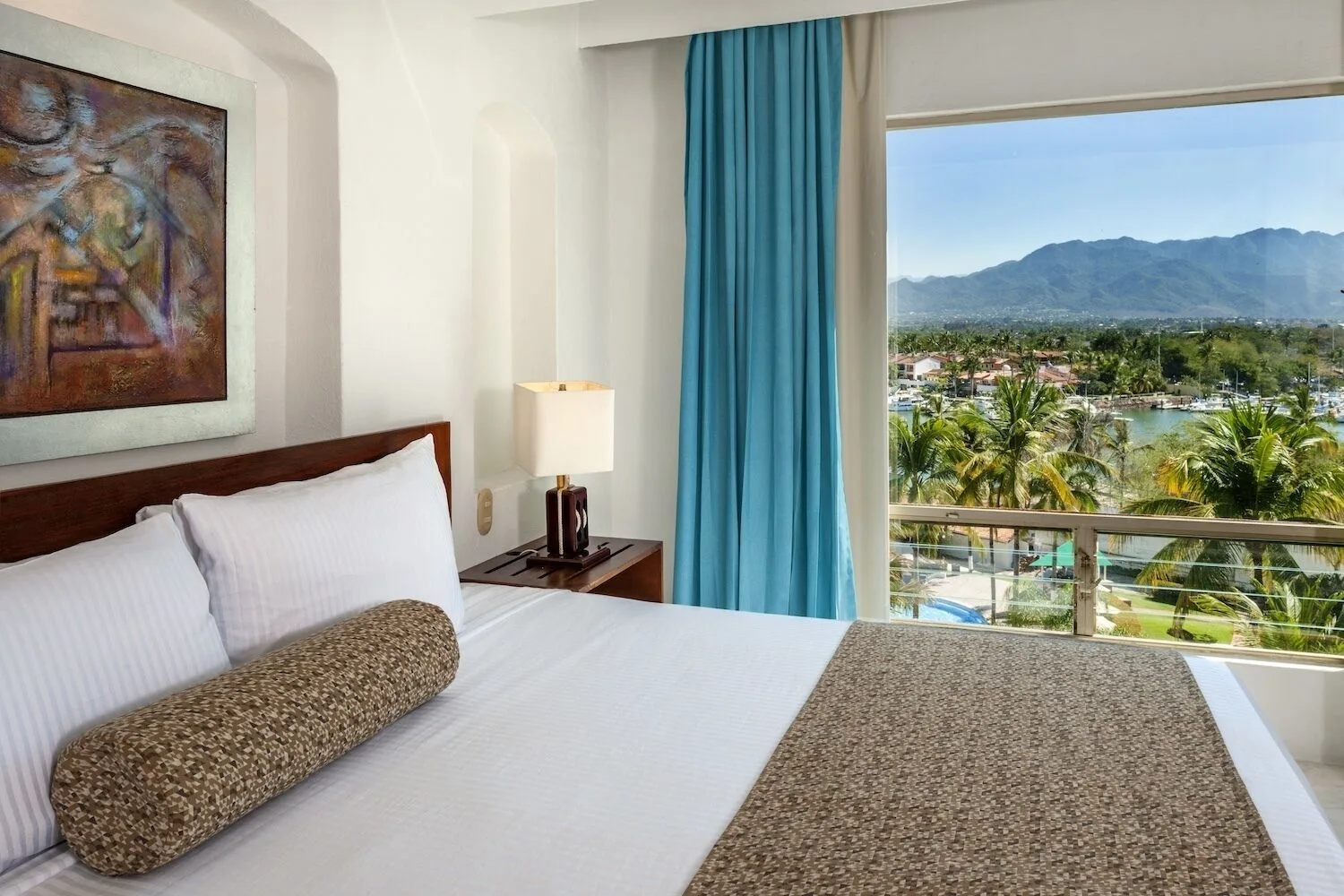 Standard king room with marina and mountain view at Vamar Vallarta Marina and Beach Resort.
