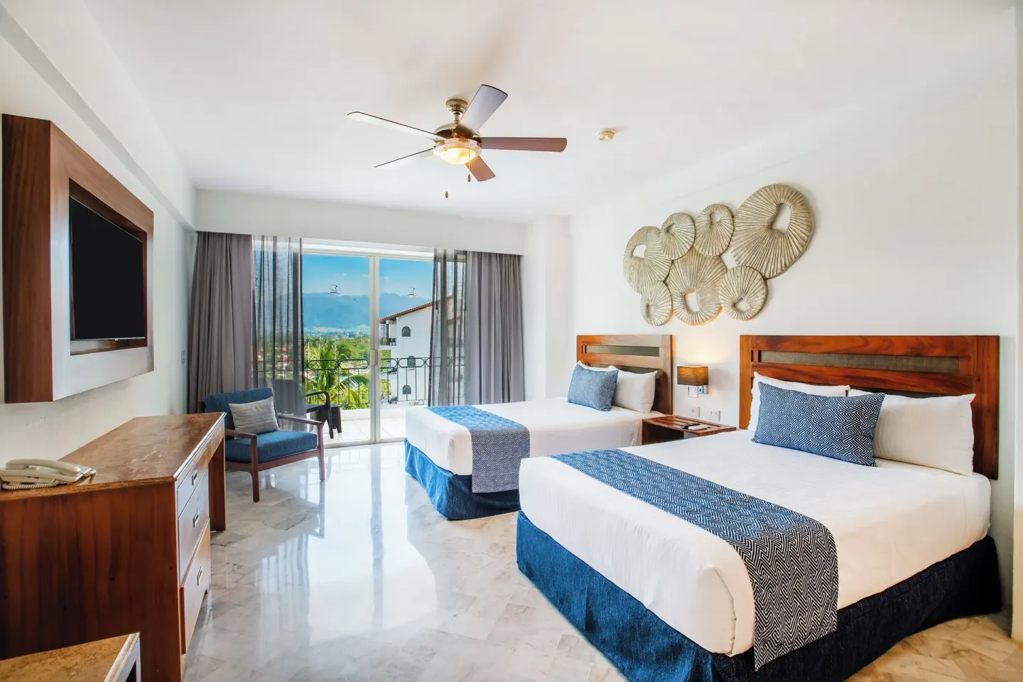 Superior Con Balcón room with two beds and balcony at Vamar Vallarta Marina and Beach Resort.