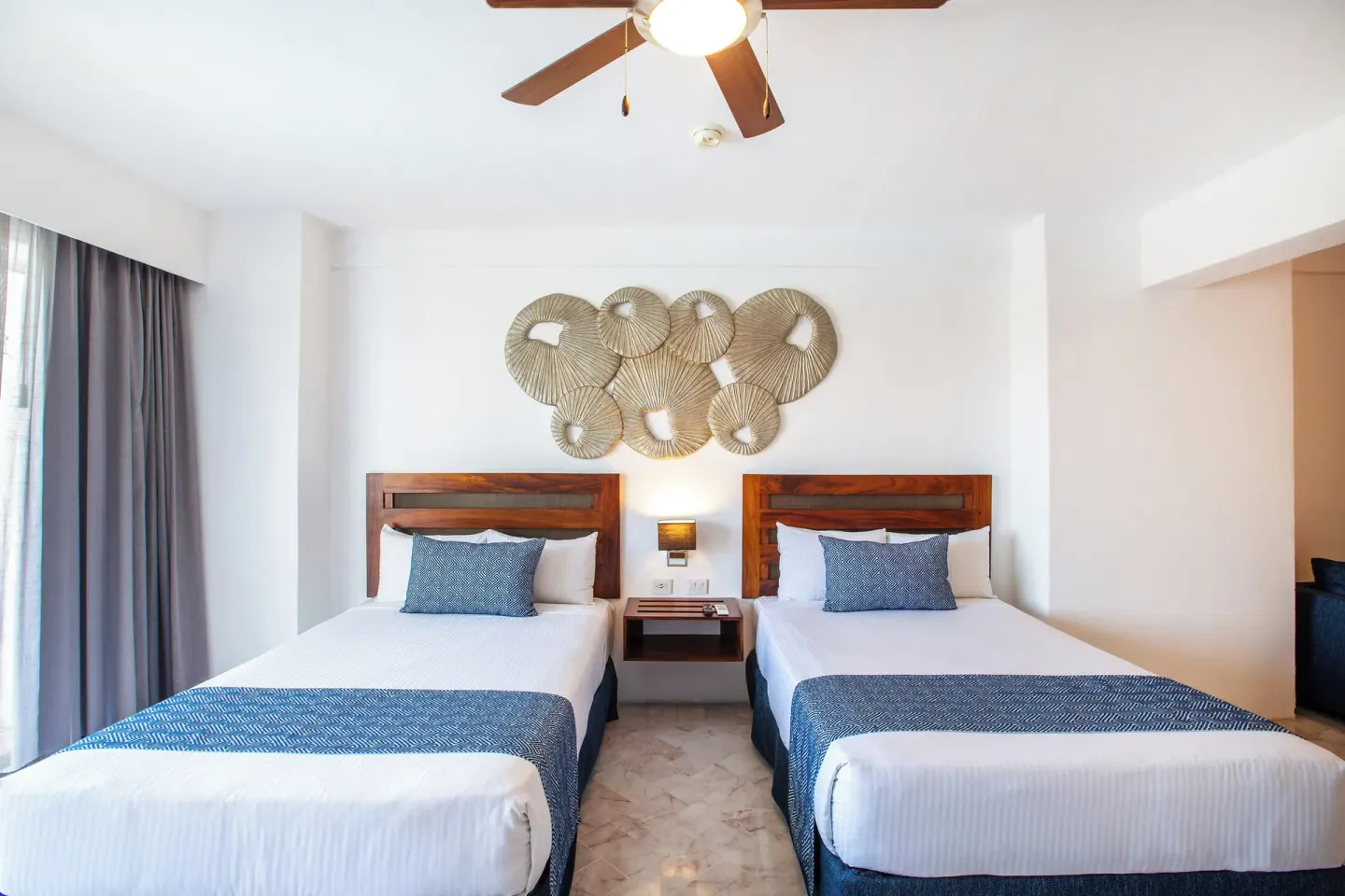 Two beds in a Superior Con Balcón room at Vamar Vallarta Marina and Beach Resort.