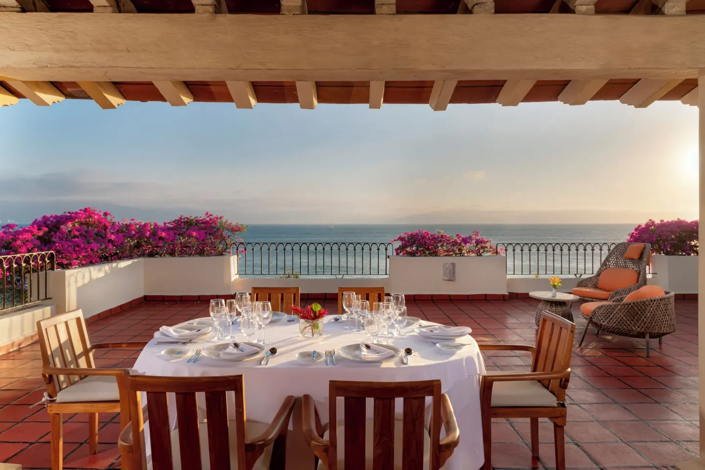 Terrace dining table facing the ocean at Velas Vallarta Suites Resort.