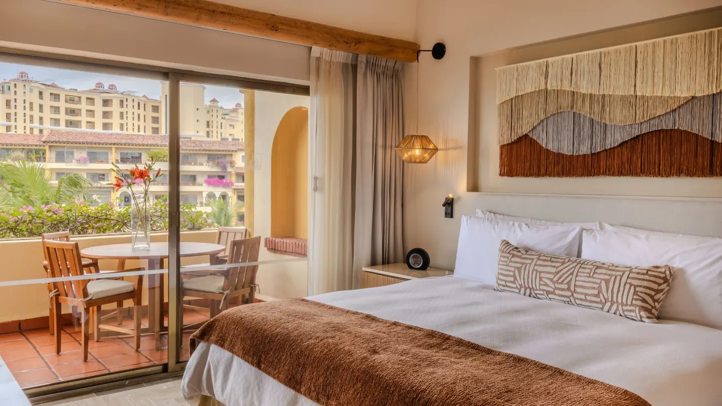 2 Bedroom Lock Off bedroom with king bed and balcony at Velas Vallarta Suites Resort.