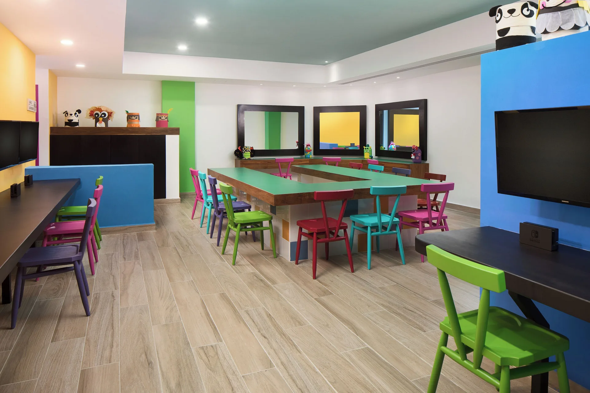 Colorful kids club tables and chairs at Ventus at Marina El Cid Spa & Beach Resort.