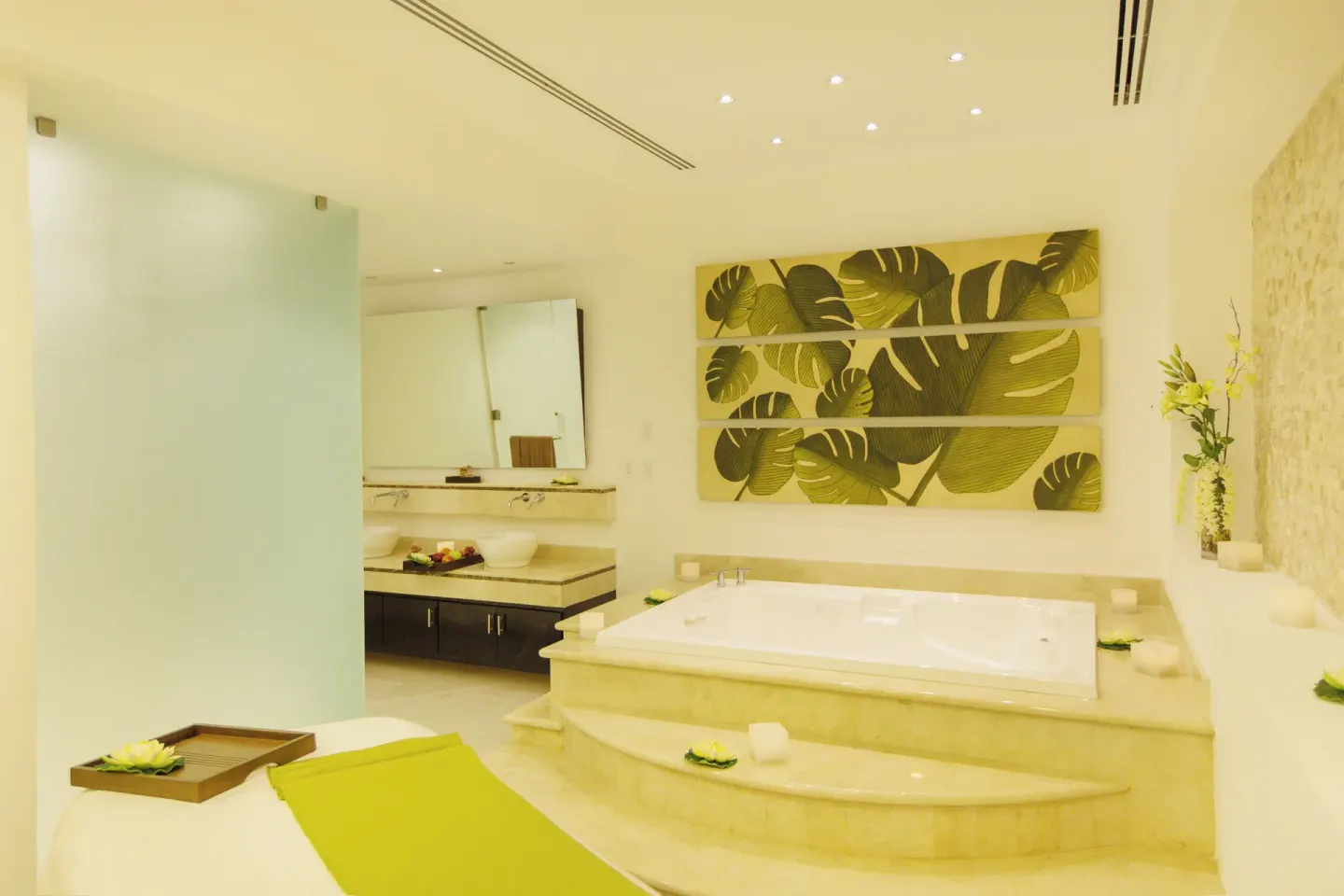 Spa treatment room with soaking tub and vanity at Ventus at Marina El Cid Spa & Beach Resort.