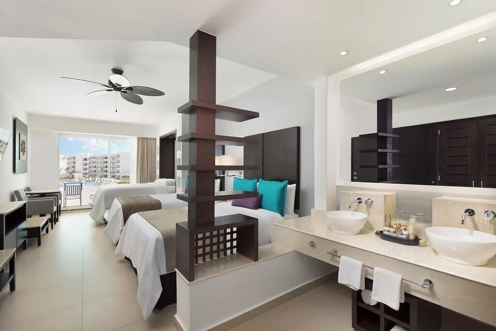 Family Room with two beds and double vanity at Ventus at Marina El Cid Spa & Beach Resort.