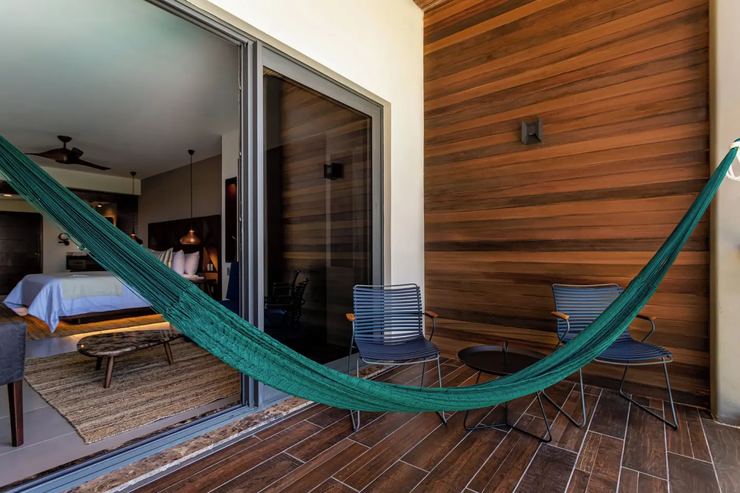 Junior Suite terrace with hammock and seating at Ventus at Marina El Cid Spa & Beach Resort.