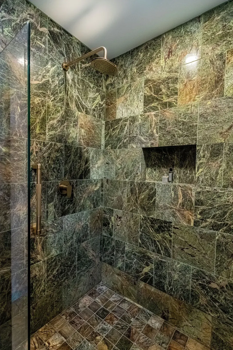 Junior Suite walk-in shower with green tile at Ventus at Marina El Cid Spa & Beach Resort.