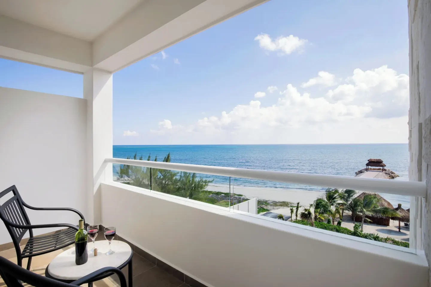 Luxury Platinum balcony with seating and ocean view at Ventus at Marina El Cid Spa & Beach Resort.