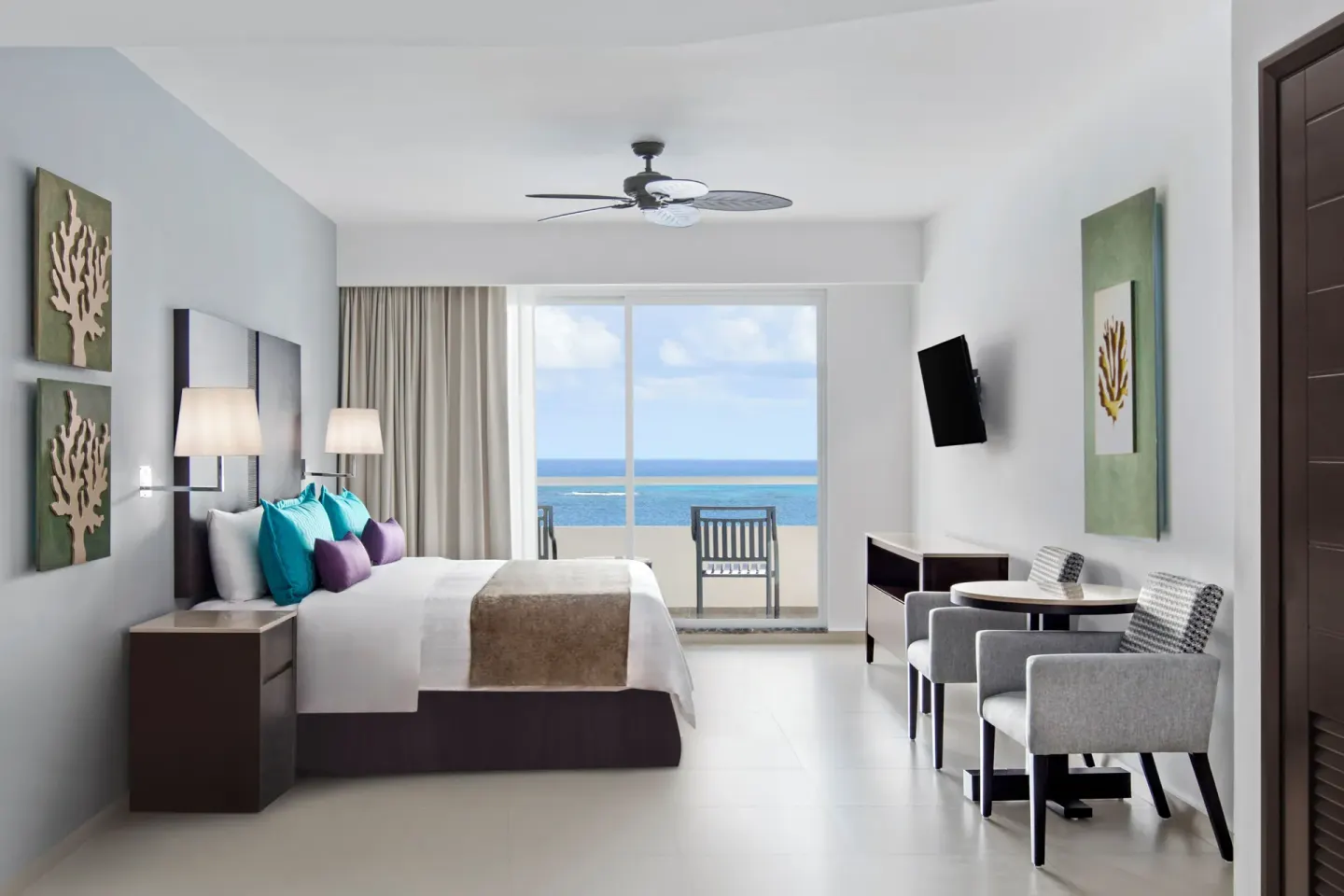 Luxury Platinum room with king bed and ocean-view balcony at Ventus at Marina El Cid Spa & Beach Resort.