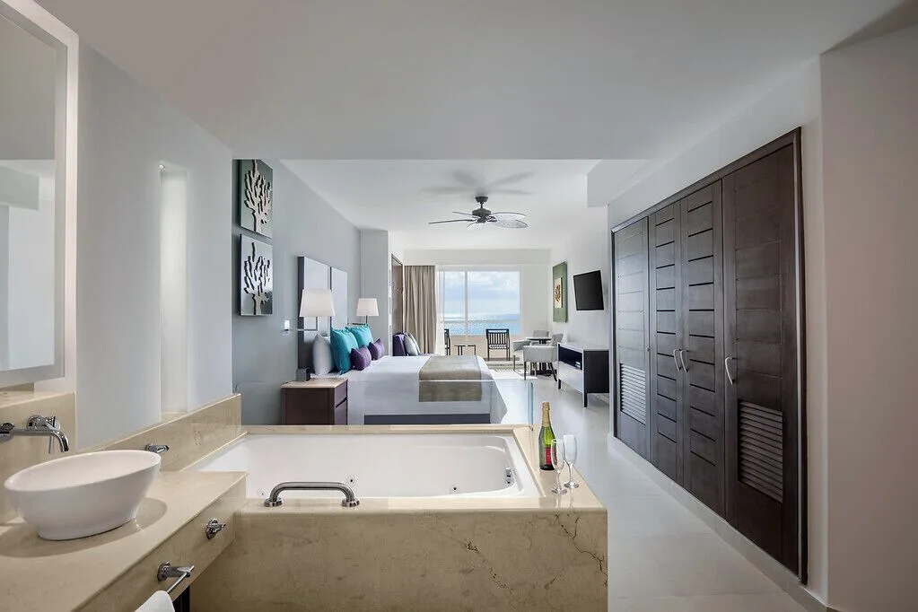 One Bedroom Suite Platinum with Jacuzzi and ocean-facing bed at Ventus at Marina El Cid Spa & Beach Resort.