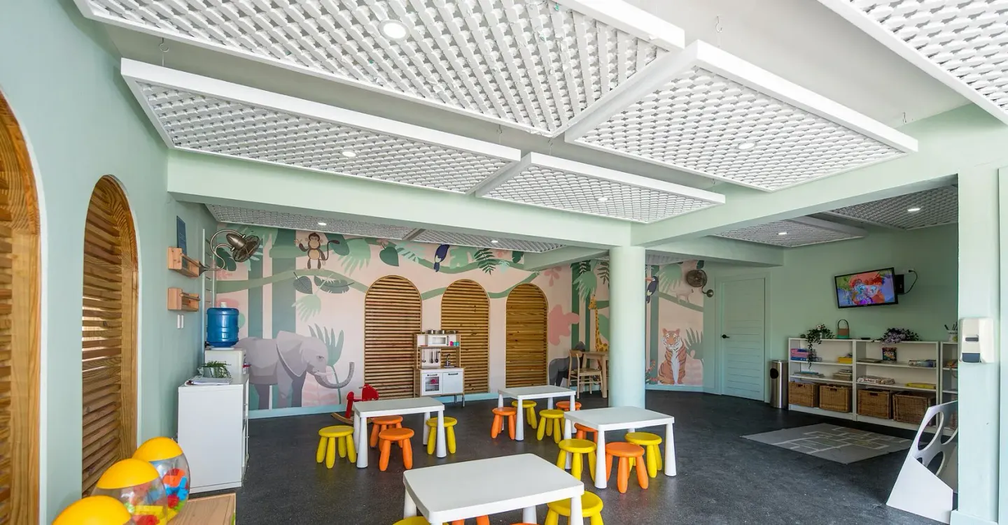 Kids club playroom with small tables and animal murals at VH Gran Ventana Beach Resort.