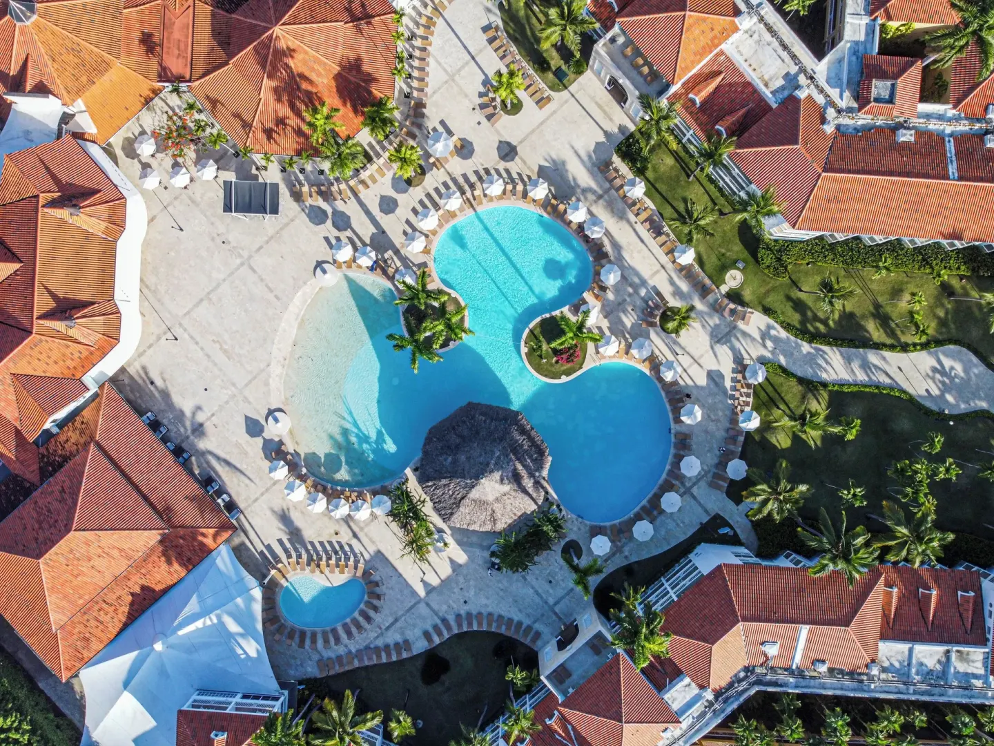 Straight-down aerial view of pools and red-roof buildings at VH Gran Ventana Beach Resort.
