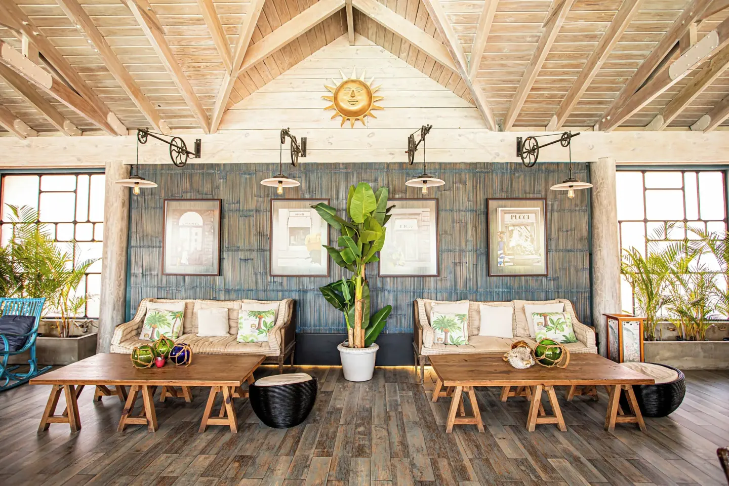 Lounge seating with sofas, plants, and wood tables at VH Gran Ventana Beach Resort.