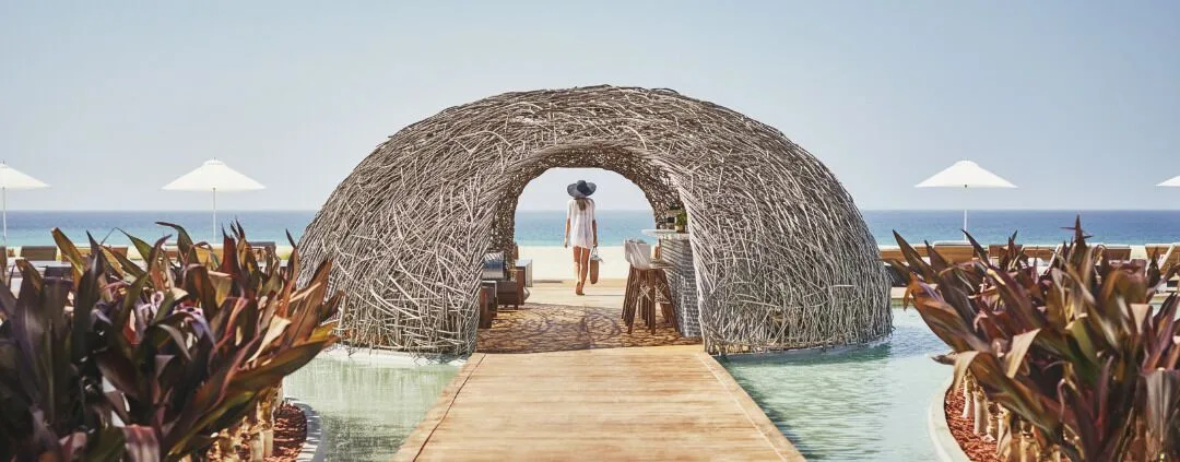 A woven beachside pavilion frames the ocean at Viceroy Los Cabos.