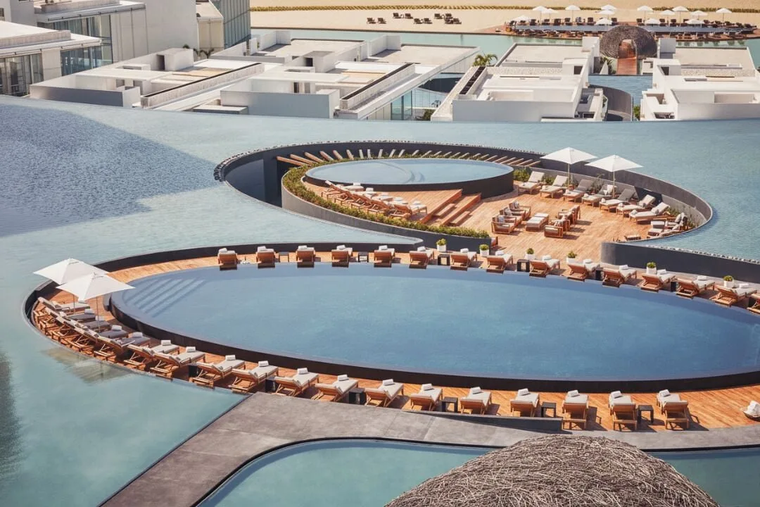 Overhead view of pool islands and lounge decks at Viceroy Los Cabos.