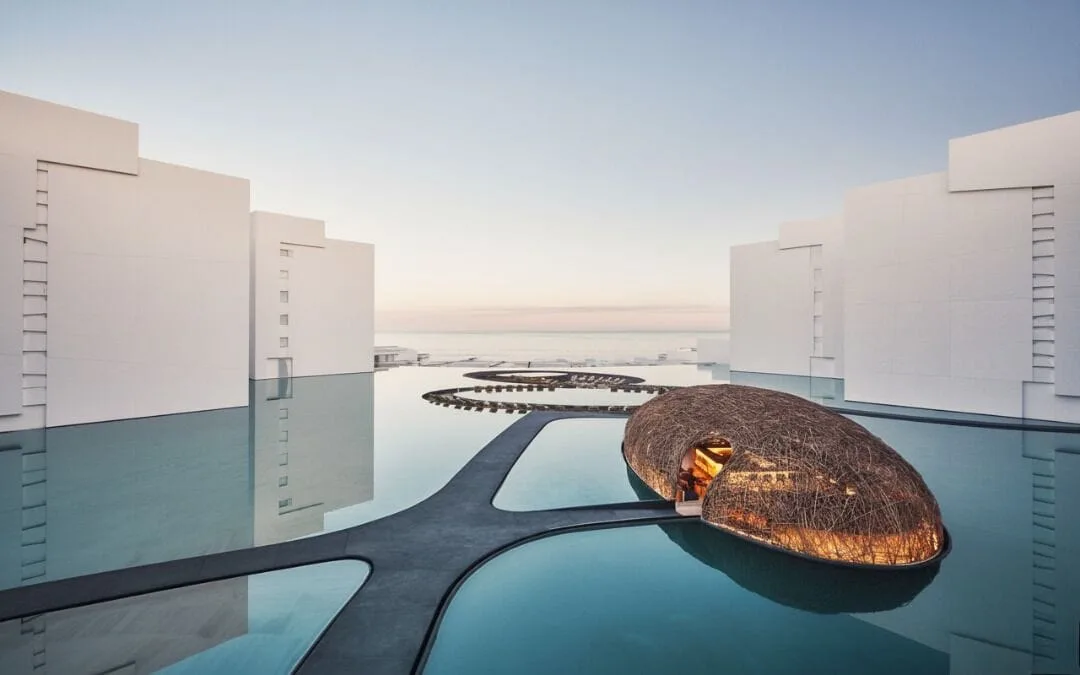 Reflecting pools, white buildings, and the nest-like restaurant at Viceroy Los Cabos.
