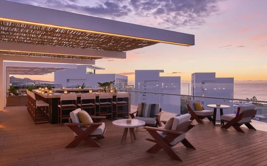 Rooftop lounge with bar seating and ocean view at Cielomar Rooftop at Viceroy Los Cabos.