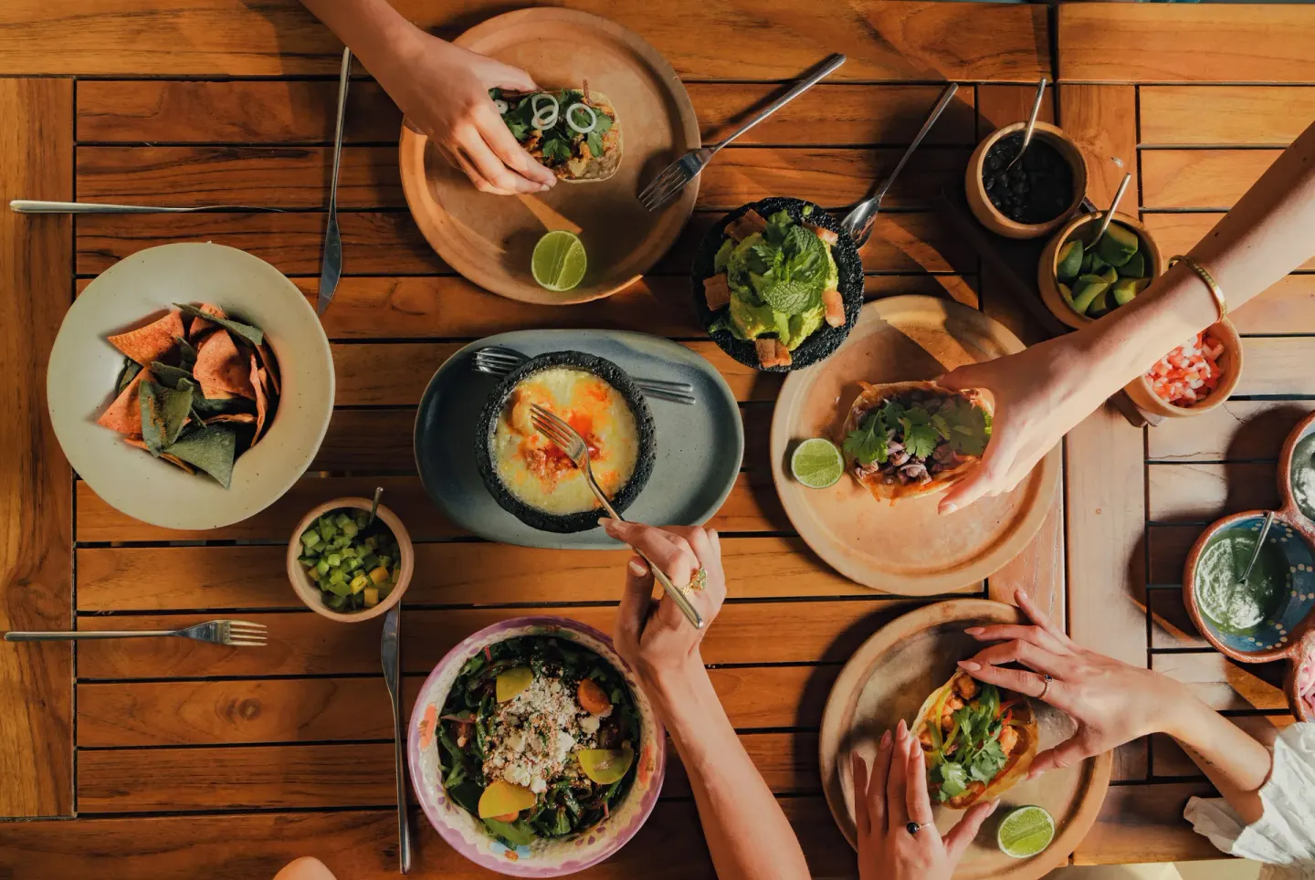 Overhead view of tacos, dips, salad and shared plates at Viceroy Los Cabos.
