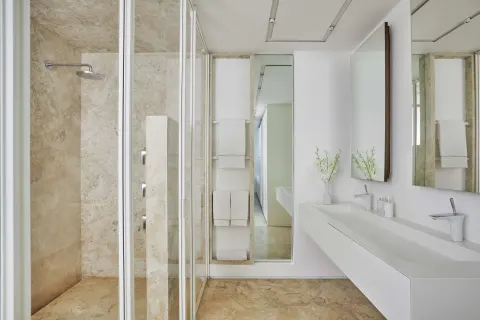 Junior Suite Resort View bathroom with shower and double vanity at Viceroy Los Cabos.