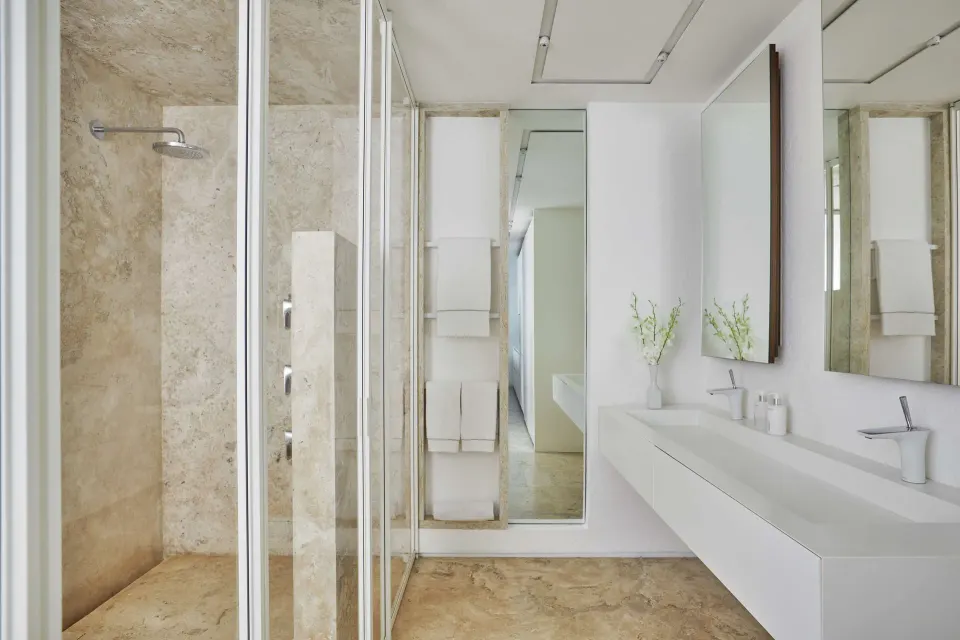 Junior Suite Resort View bathroom with shower and double vanity at Viceroy Los Cabos.