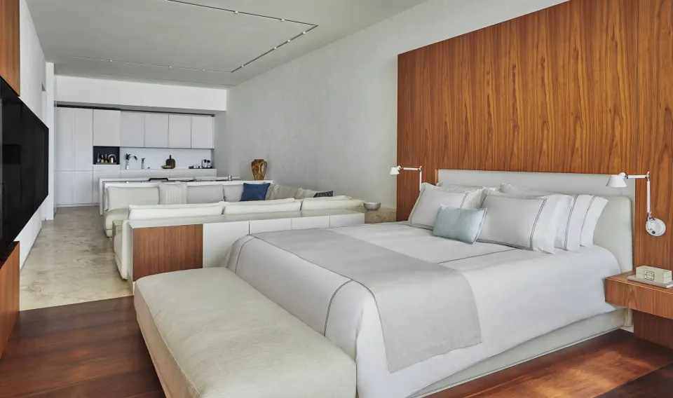 Junior Suite Resort View king bed with lounge and kitchenette behind at Viceroy Los Cabos.