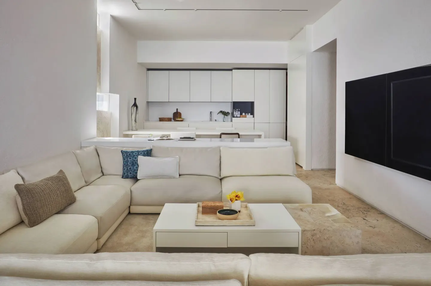 Junior Suite Resort View living area with sofa and kitchenette at Viceroy Los Cabos.
