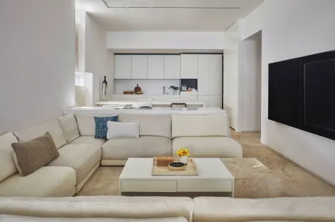 Junior Suite Resort View living area with sofa and kitchenette at Viceroy Los Cabos.