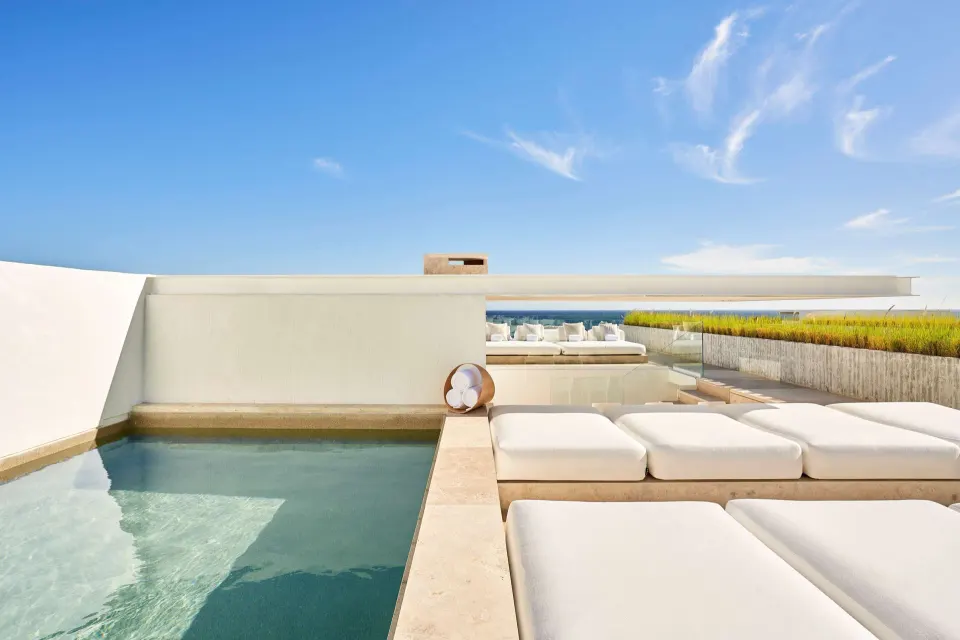 Private terrace pool at a 3 Bedroom Waterside Casita at Viceroy Los Cabos with cushioned loungers.