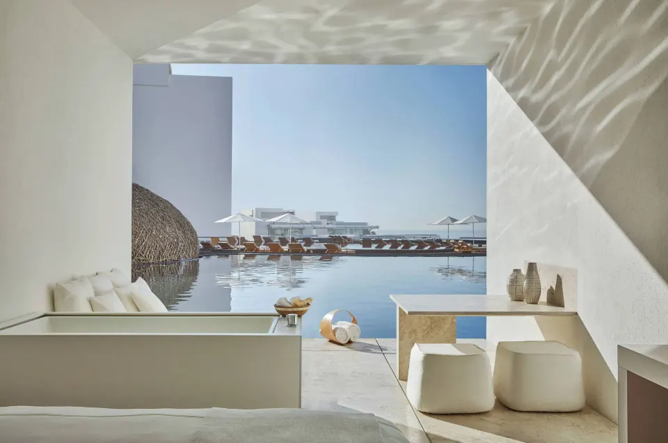 Partial Ocean View room terrace with pool and loungers at Viceroy Los Cabos.