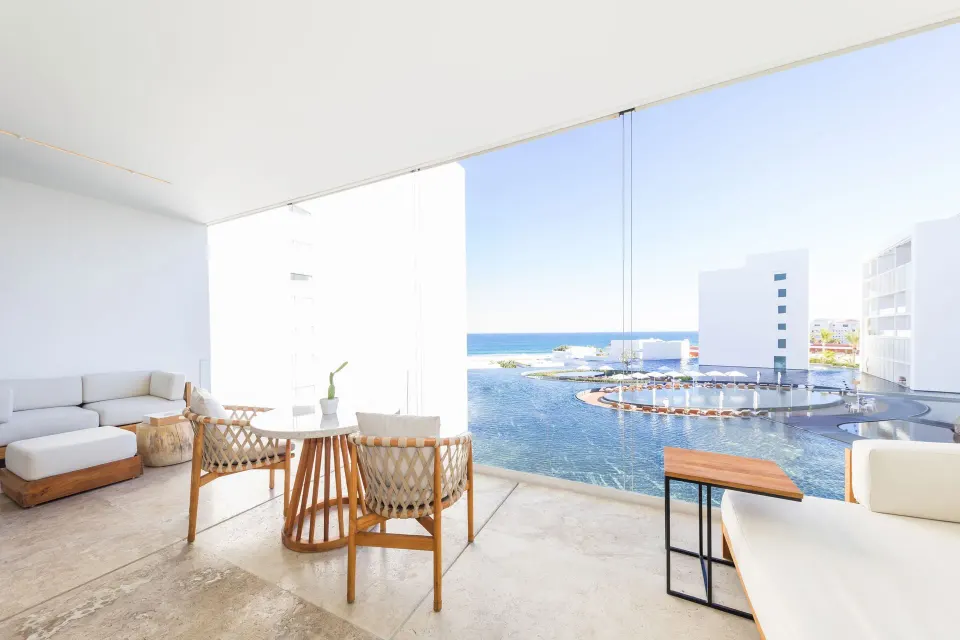 One Bedroom Partial Ocean View suite balcony with seating and ocean view at Viceroy Los Cabos.