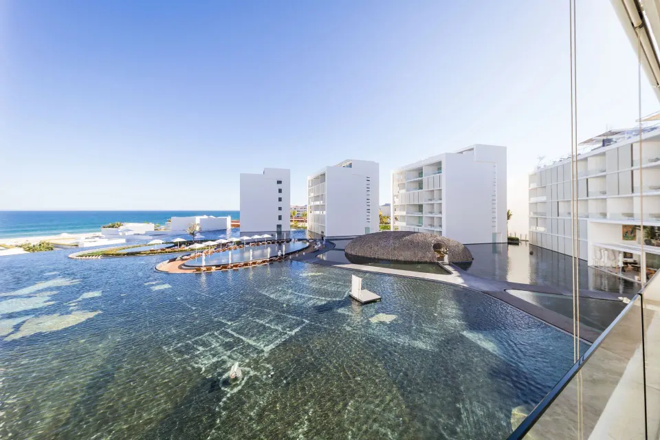 Partial ocean and resort water feature view from a suite balcony at Viceroy Los Cabos.
