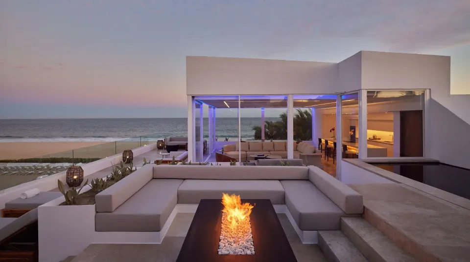 Oceanfront suite terrace with fire feature and beach view at Viceroy Los Cabos.