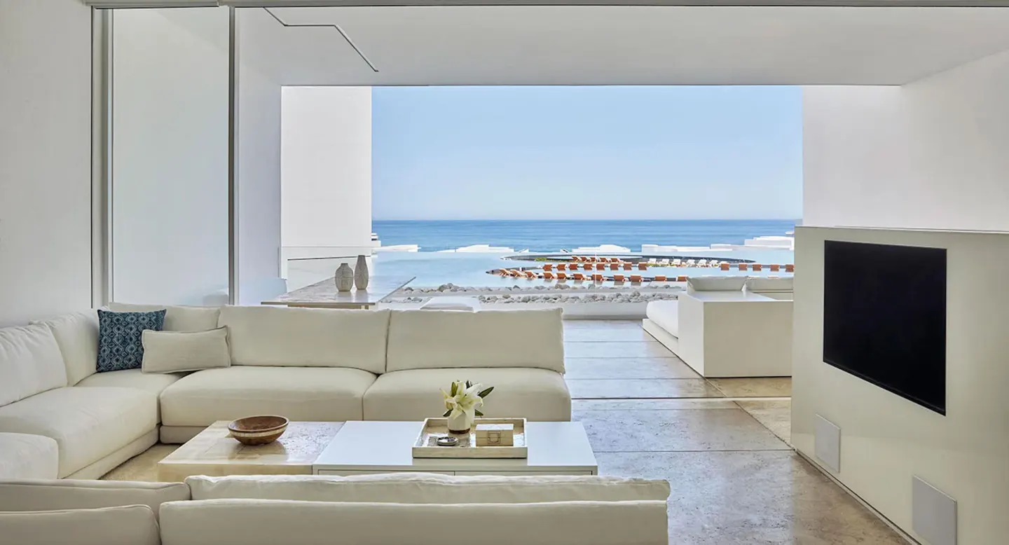 Ocean View Suite living room opens to a sea-facing terrace at Viceroy Los Cabos.