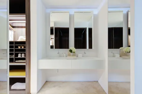 Villa bathroom vanity and open closet at Viceroy Los Cabos.