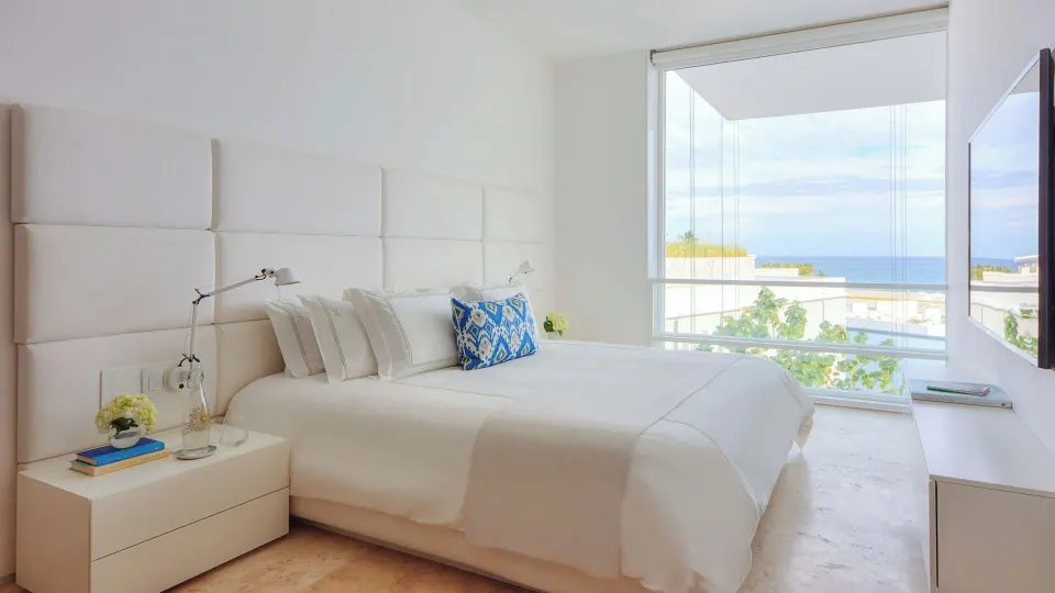 Villa king bedroom with ocean view window at Viceroy Los Cabos.