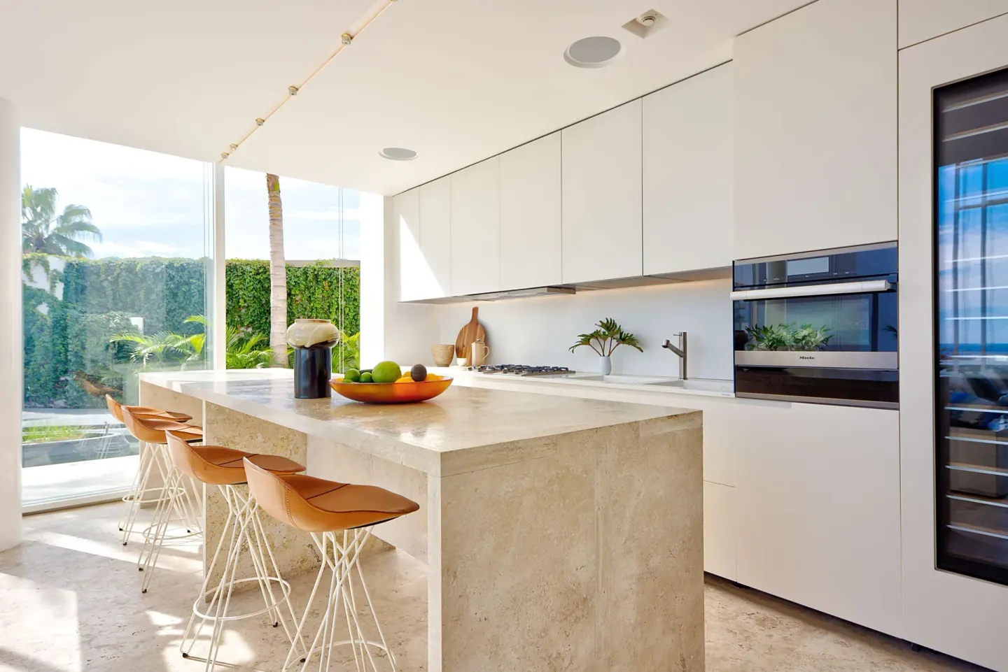 Modern villa kitchen with island seating at Viceroy Los Cabos.