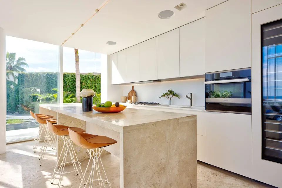Modern villa kitchen with island seating at Viceroy Los Cabos.