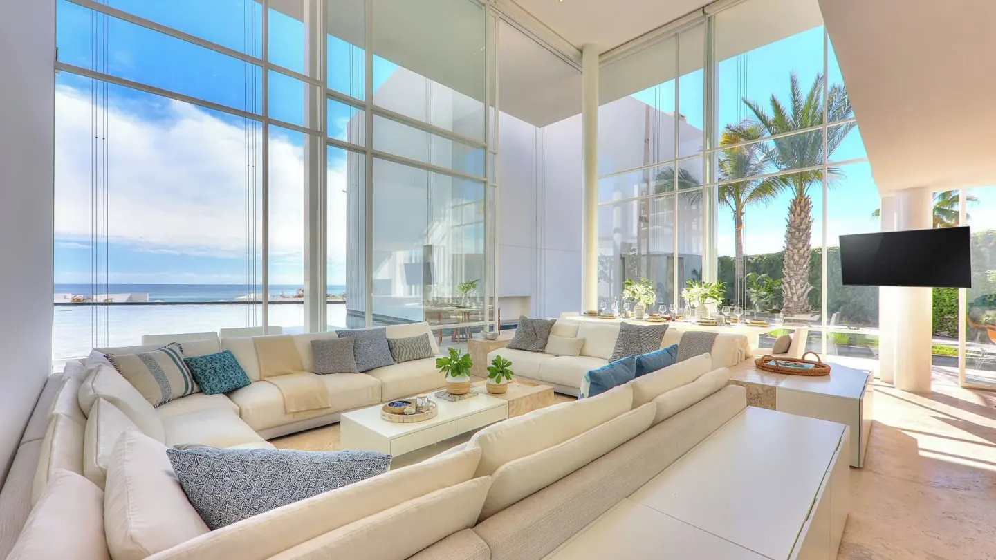 Villa living room with ocean-facing glass walls at Viceroy Los Cabos.