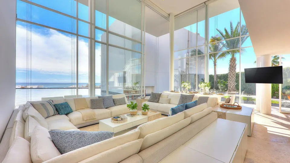 Villa living room with ocean-facing glass walls at Viceroy Los Cabos.