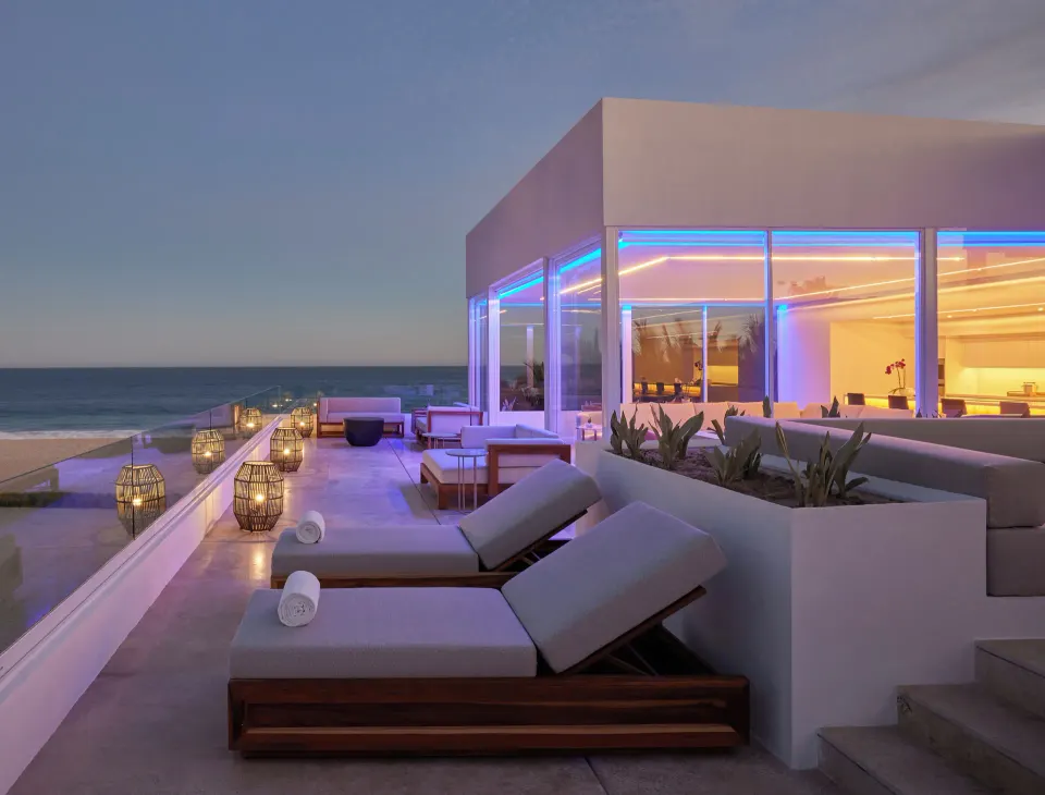 Oceanfront villa terrace with loungers and lanterns at Viceroy Los Cabos.