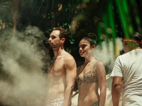 Guests surrounded by steam during an outdoor wellness ritual at Viceroy Riviera Maya.