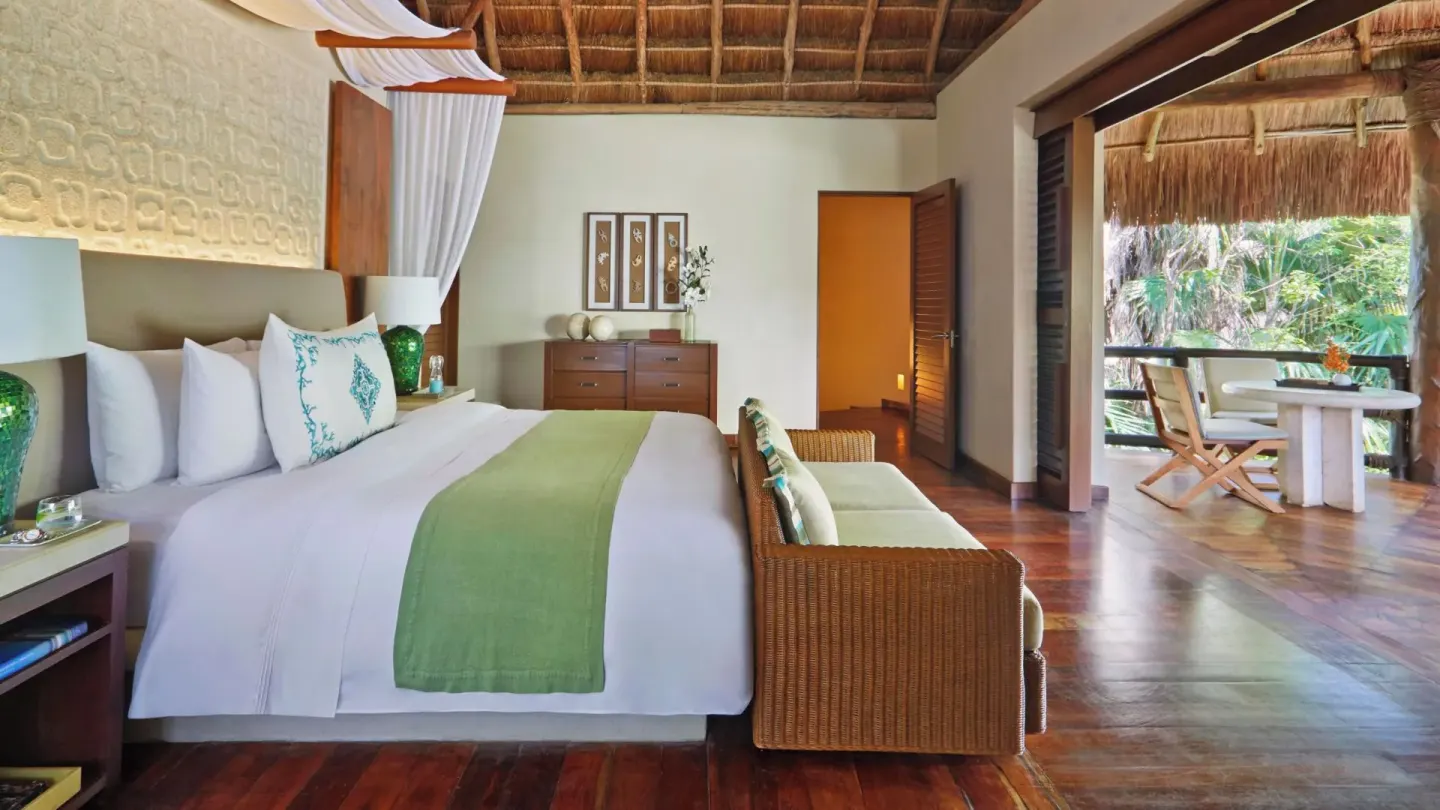 Ocean View Two Level Villa bedroom with king bed and terrace at Viceroy Riviera Maya.