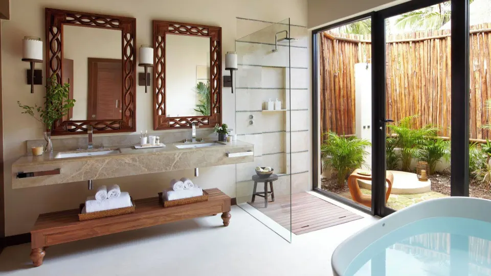 Double vanity and soaking tub in a Premium Villa bathroom at Viceroy Riviera Maya.