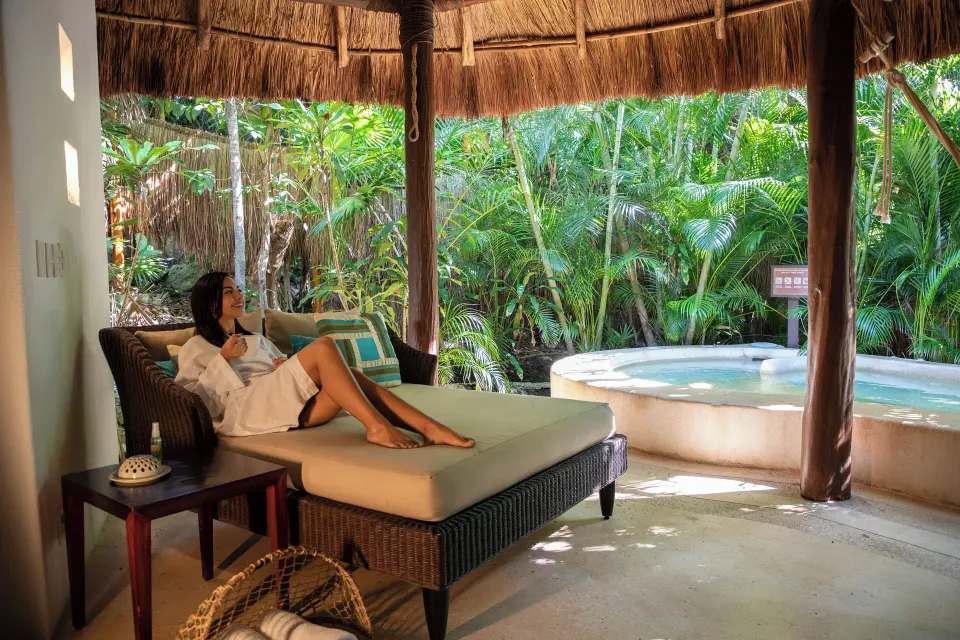 Royal Villa lounge terrace and plunge pool in a tropical garden at Viceroy Riviera Maya.