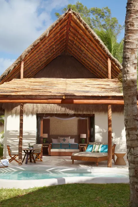 Viceroy Riviera Maya deck with plunge pool and bed visible at Viceroy Riviera Maya.