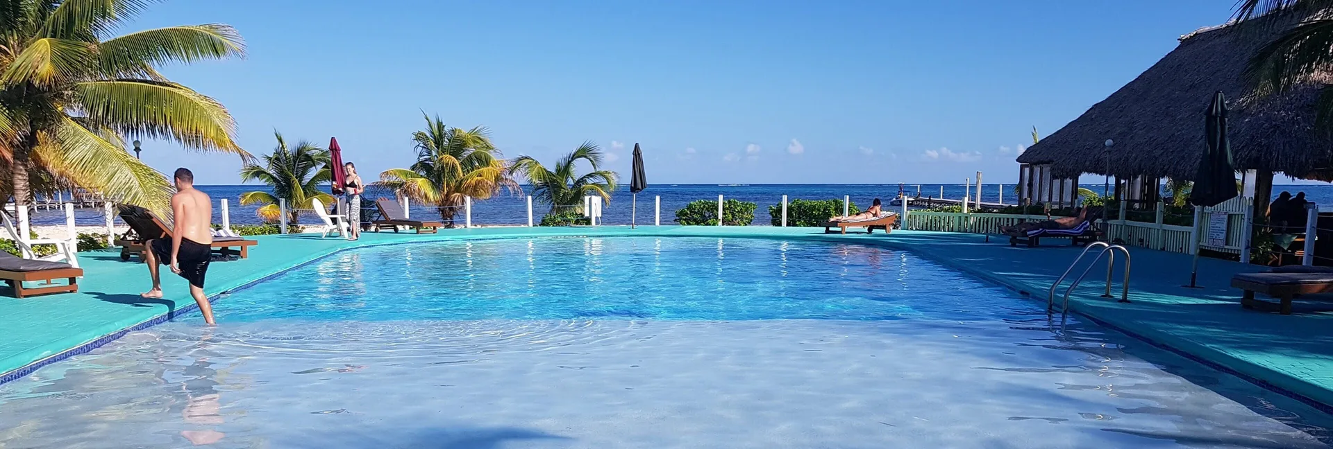 Royal Caribbean Resort casual Belize beachfront resort with colorful casitas and relaxed grounds