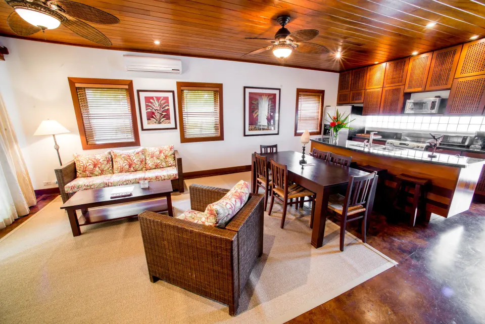 One Bedroom Infinity Suite dining area and kitchen at Victoria House Resort & Spa.