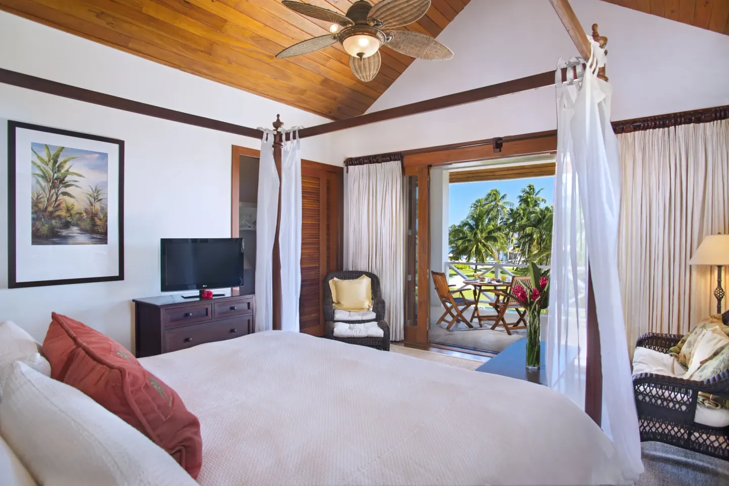 One Bedroom Infinity Suite king bed with balcony view at Victoria House Resort & Spa.