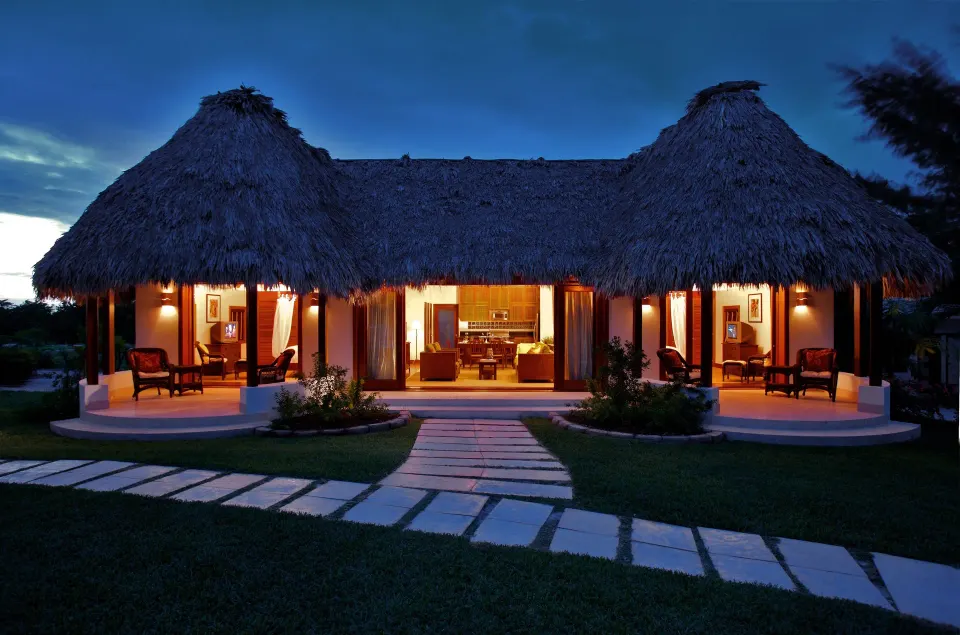 2 Bedroom Luxury Villa exterior lit at dusk at Victoria House Resort & Spa.